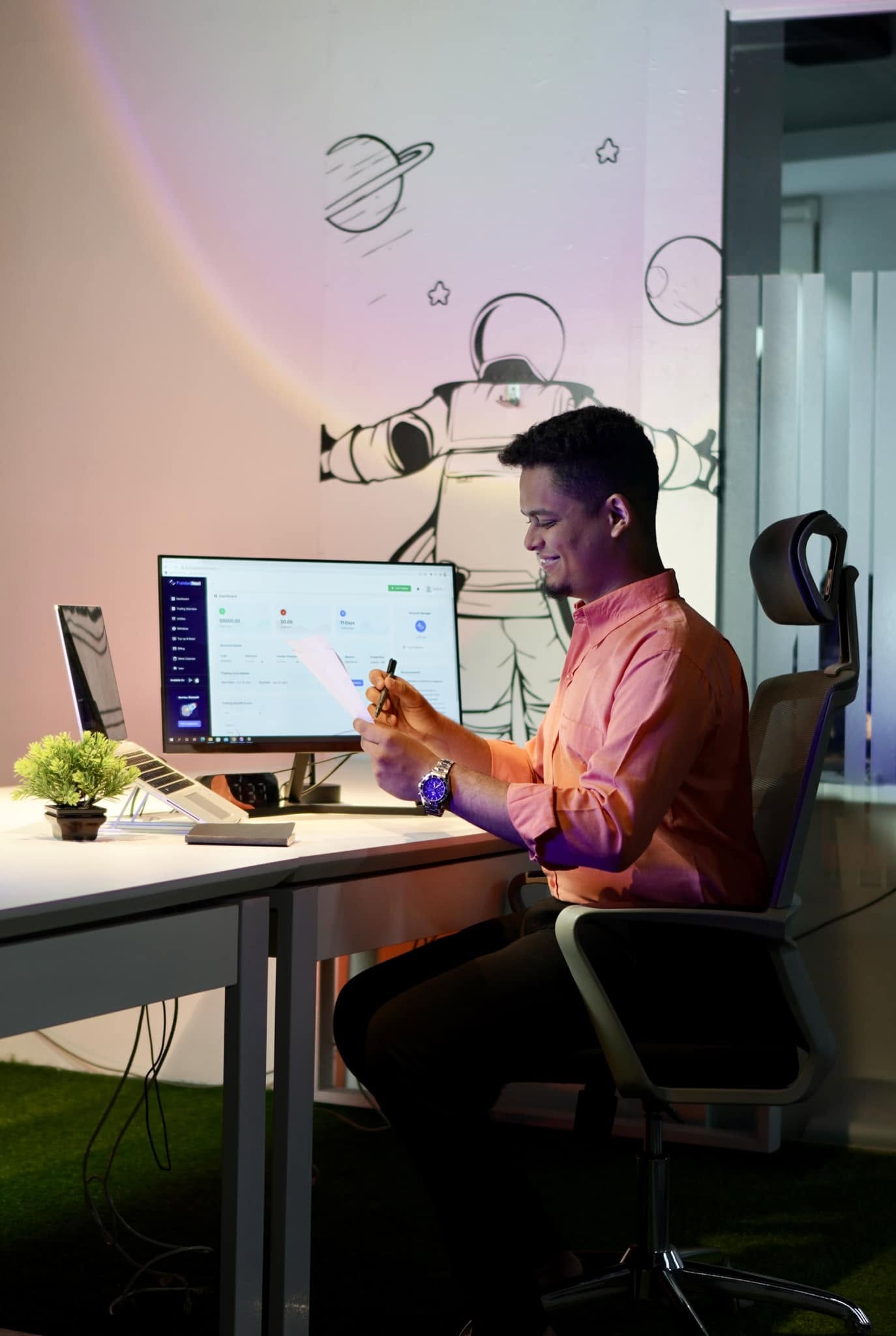 Rifat working at his desk